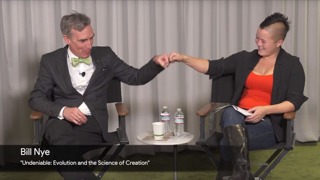 Bill Nye fist bumping interviewer during his Google Talks.